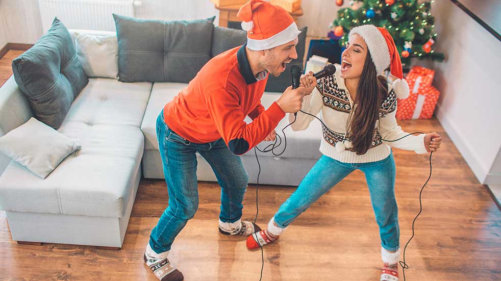 25 free things to do in December couple singing Christmas karaoke